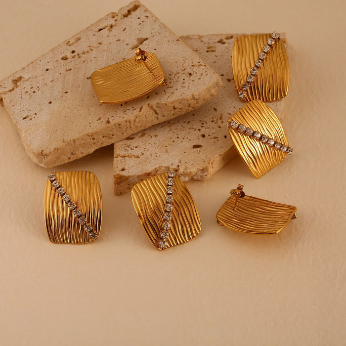 Wholesale Fashionable and personalized stainless steel zircon inlaid earrings and rings set, temperament earrings and bracelets