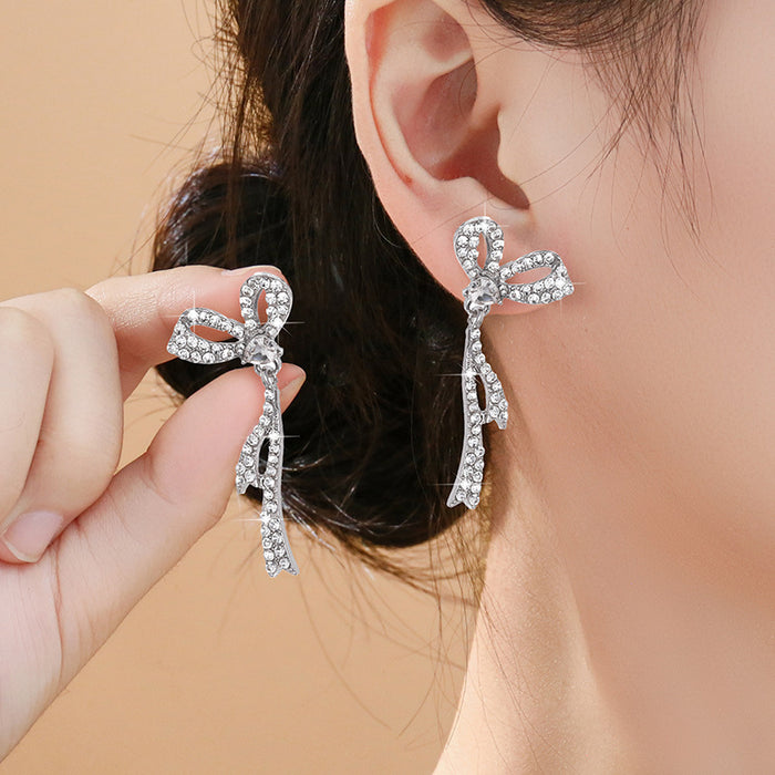 Wholesale Silver needle bow tassel earrings for women