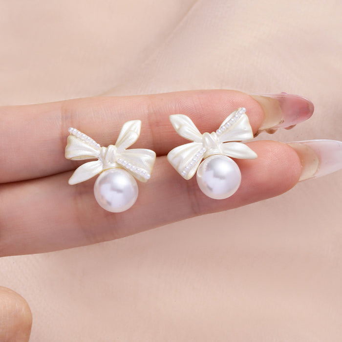 Wholesale White copper silver needle bow lily of the valley pearl earrings women's screw buckle