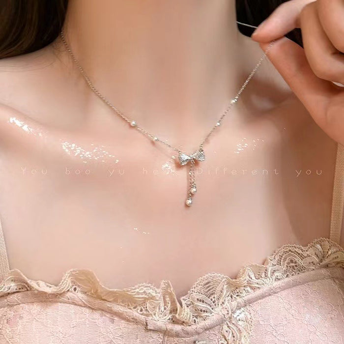 Wholesale Pearl bow tassel necklace, light luxury, niche collarbone chain, high-end necklace, versatile accessories and accessories