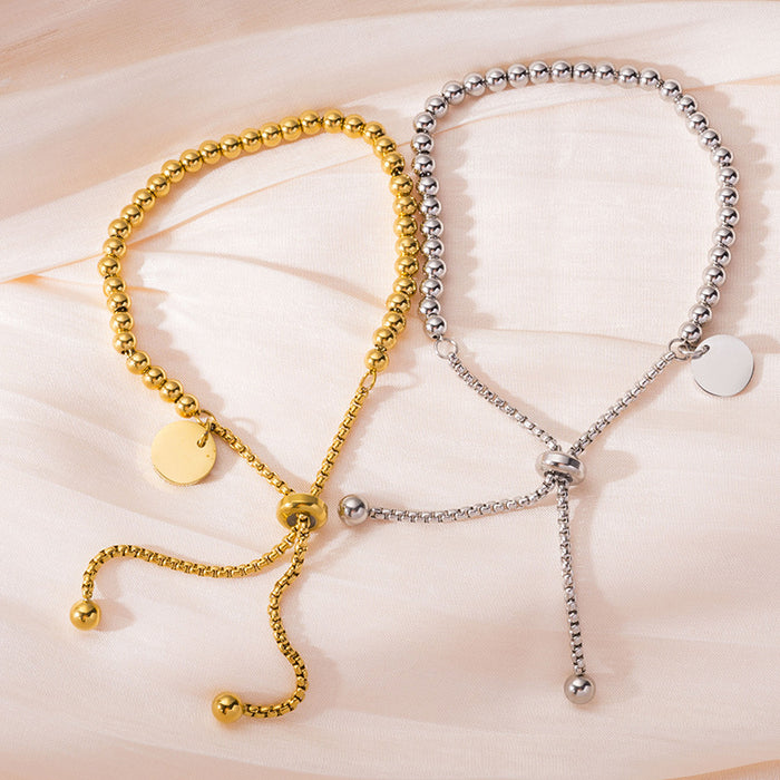 Wholesale Fashionable stainless steel bracelet with simple and fashionable circular hang tag, adjustable round bead, personalized pull-out bracelet