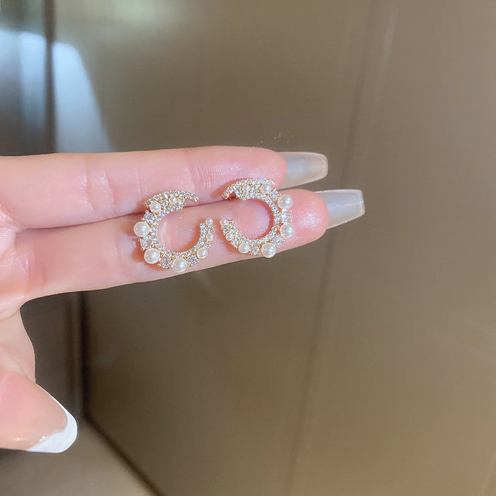 Wholesale Silver needle zircon round artificial pearl earrings high-end luxury retro earrings unique French design earrings