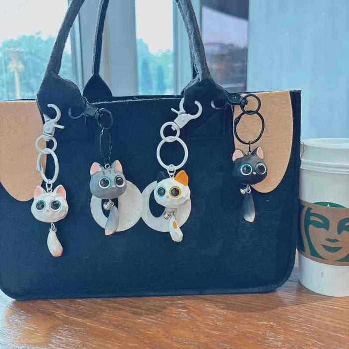 Wholesale Cute cartoon big-eyed cat head resin couple hanging tail cat pendant small gift doll key