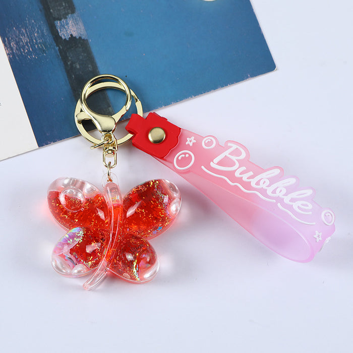 Wholesale Acrylic oil butterfly quicksand keychain bag pendant candy color