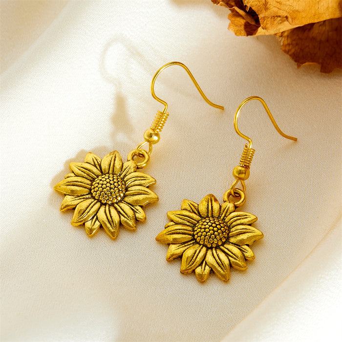 Wholesale Exaggerated gold sunflower titanium steel gold-plated earrings