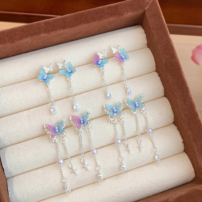 Wholesale Resin pearl butterfly earrings with tassels and silver needles, sweet temperament, light luxury, high-end feel, versatile earrings