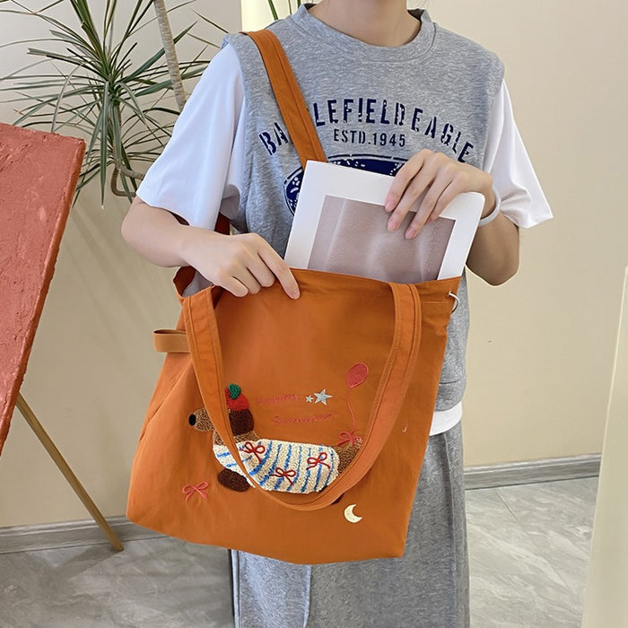 Wholesale New cute cartoon embroidered drawstring shoulder bag, fashionable and simple canvas bag, large capacity tote bag