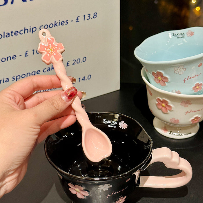 Wholesale Pink ceramic stemmed cup with cherry blossom relief design and spoon