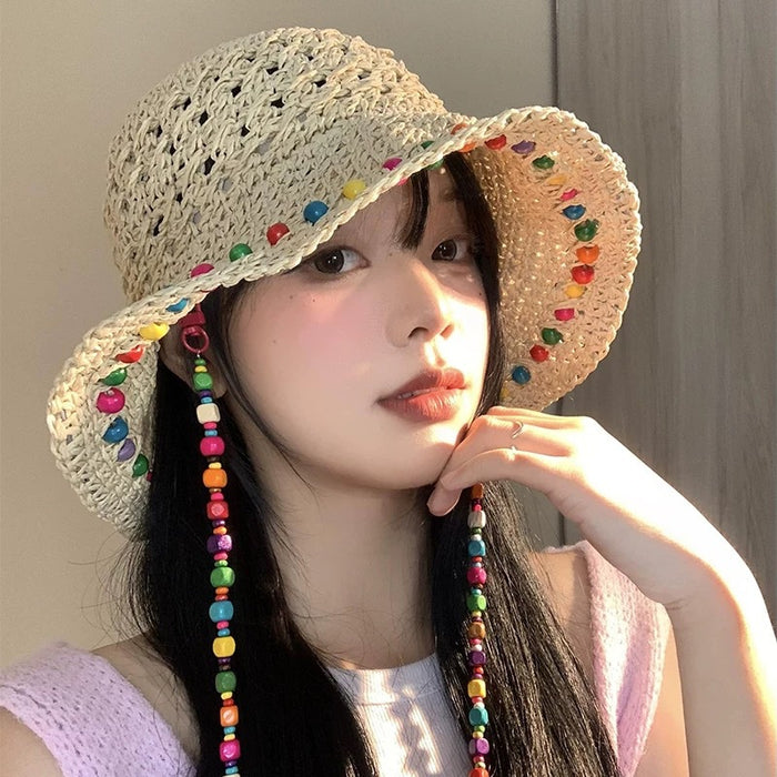 Wholesale Colorful wooden bead grass hat for women in summer with hollowed out large brim for sun protection and foldable fisherman hat