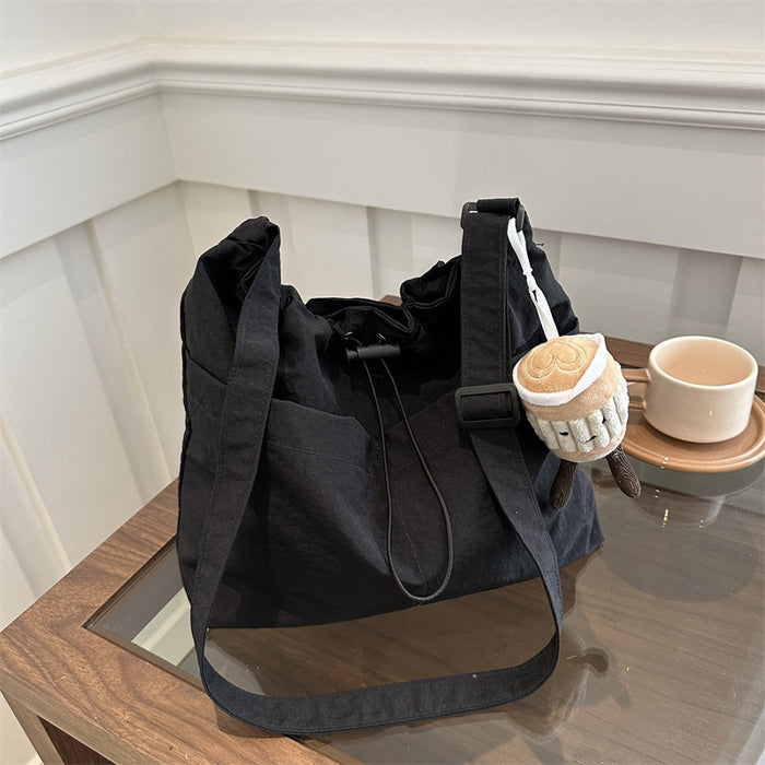 Wholesale Niche casual artistic canvas bucket bag, fashionable drawstring single shoulder pleated nylon crossbody bag