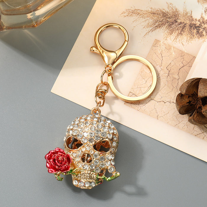 Wholesale Trendy Rhinestone Skull Keychain with Zinc Alloy Bag Charm