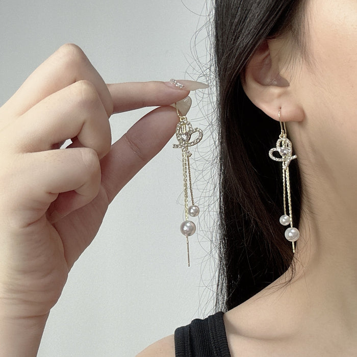 Wholesale Elegant and sparkling diamond studded heart-shaped tassel pearl ear line design, personalized and fashionable temperament, trendy ear accessories