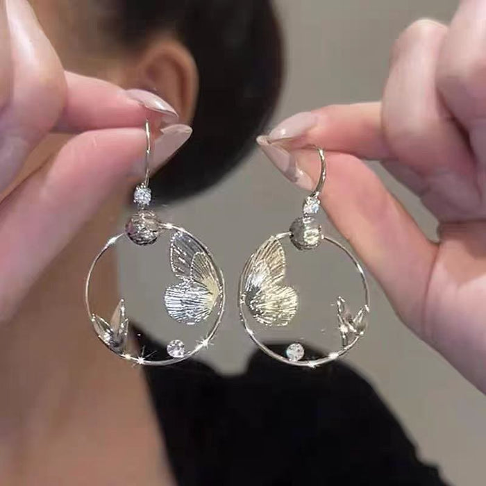 Wholesale Sparkling diamond dynamic hollow butterfly tassel earrings, light luxury temperament, high-end feeling, niche earrings, exaggerated earrings