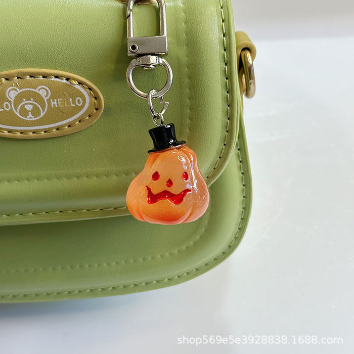 Wholesale Novelty  Pumpkin Pendant Keychain Glow In The Dark Resin Black Hat Design Bag And Earphone Case Charm Gift For Students And Couples