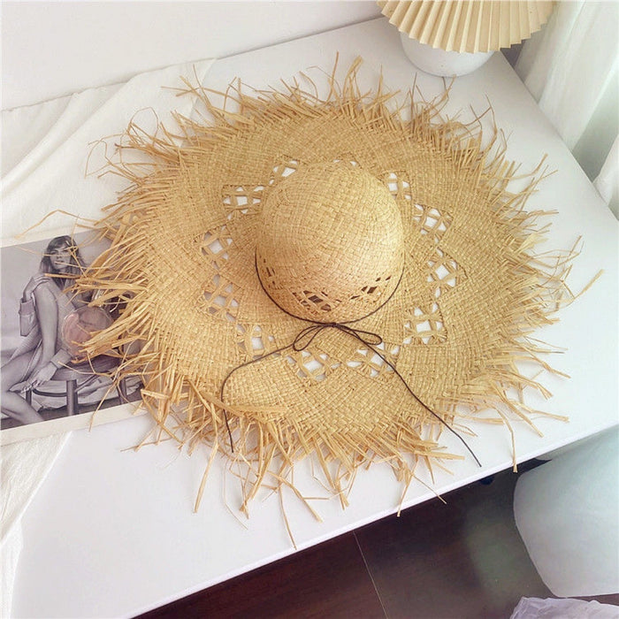 Wholesale Big brim frayed Lafite grass hat women's beach hat for beach vacation, sun protection and sunshade hat