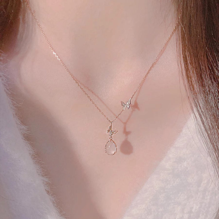 Wholesale Pure silver powder crystal droplet butterfly necklace for women, light luxury, niche, high-end design, collarbone chain