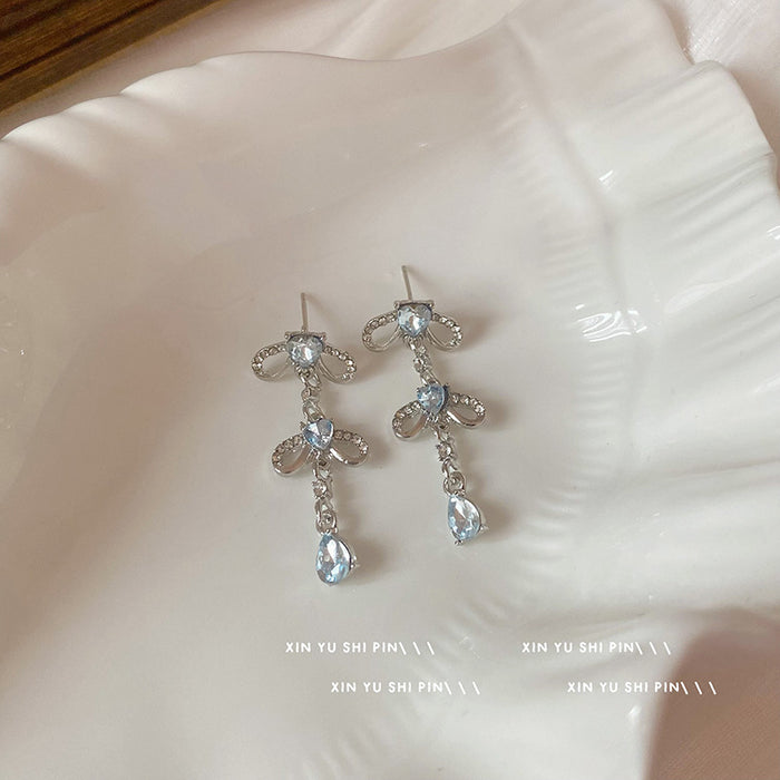 Wholesale Blue heart-shaped zircon bow earrings, niche design, exaggerated earrings, high-end water droplet pendant, long earrings