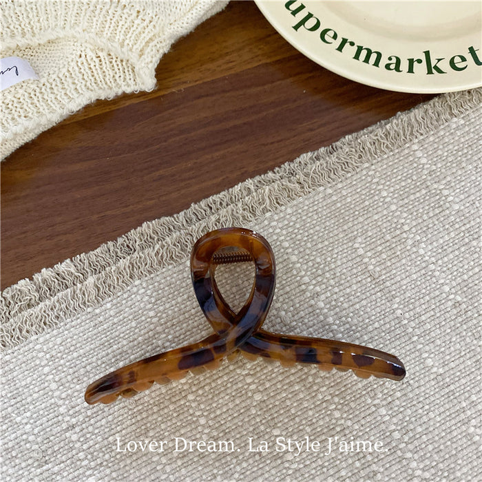 Wholesale Leopard print cross bow geometric hair clip, fashionable grip clip, versatile hair accessory