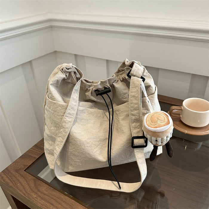 Wholesale Niche casual artistic canvas bucket bag, fashionable drawstring single shoulder pleated nylon crossbody bag