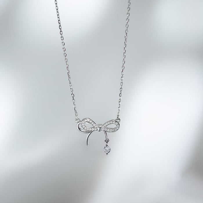 Wholesale Bow studded diamond hollow necklace, light luxury high-end pendant, niche design, collarbone chain