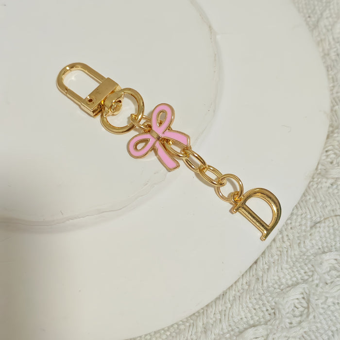 Wholesale Pink bow A-Z keychain alloy accessory