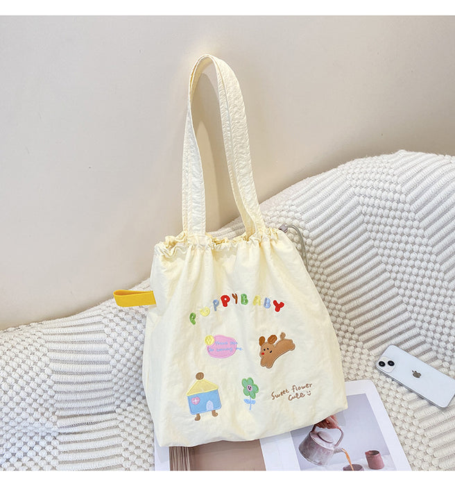 Wholesale New cute cartoon embroidered drawstring shoulder bag, fashionable and simple canvas bag, large capacity tote bag