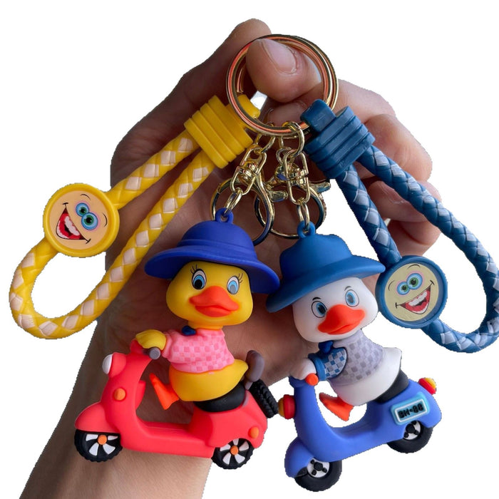 Wholesale Tram couple duck keychain couple backpack pendant claw machine doll car keychain exquisite small gift wholesale