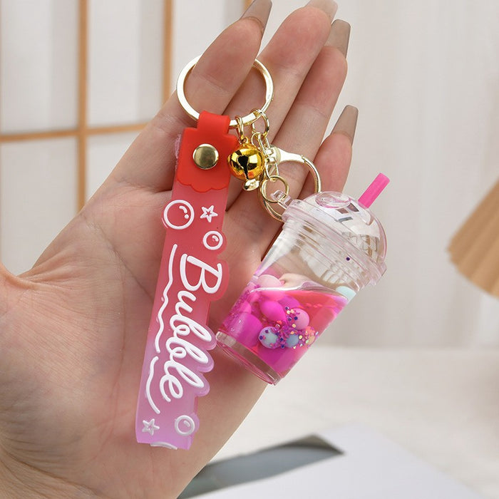 Wholesale Acrylic oil bottle candy Bean astronaut keychain