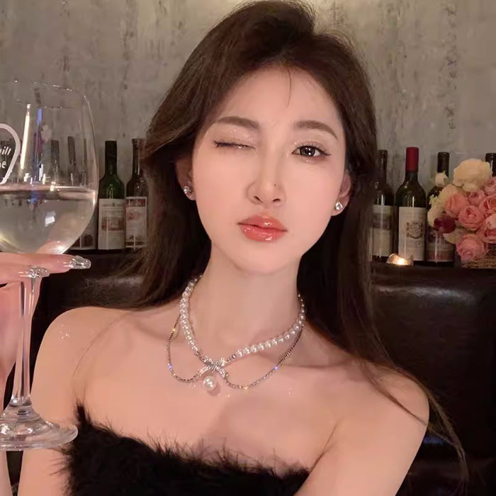 Wholesale A niche retro bow pearl necklace with diamond inlay, simple and elegant temperament