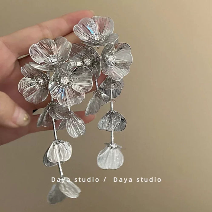 Wholesale Sparkling diamond dynamic hollow butterfly tassel earrings, light luxury temperament, high-end feeling, niche earrings, exaggerated earrings