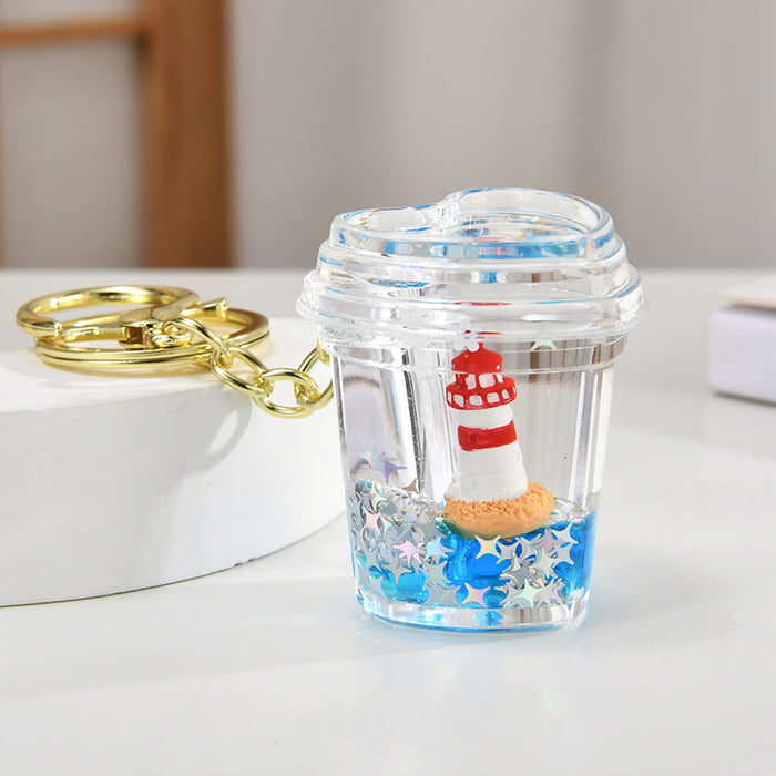 Wholesale Acrylic sailboat lighthouse blue oil-filled quicksand bottle keychain