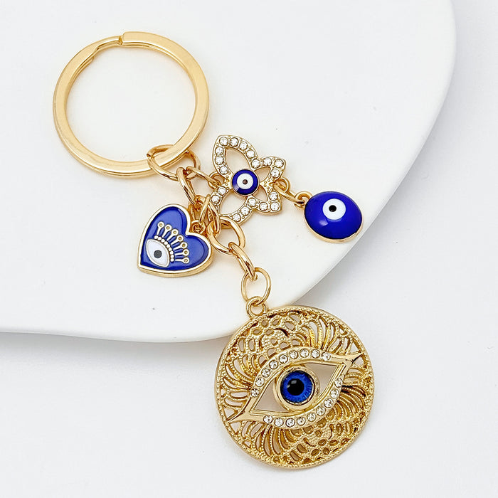 Wholesale Diamond-encrusted blue eyes evil eye tassel keychain