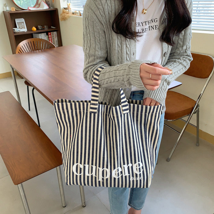 Wholesale Large capacity striped canvas backpack, casual open letter single shoulder canvas bag