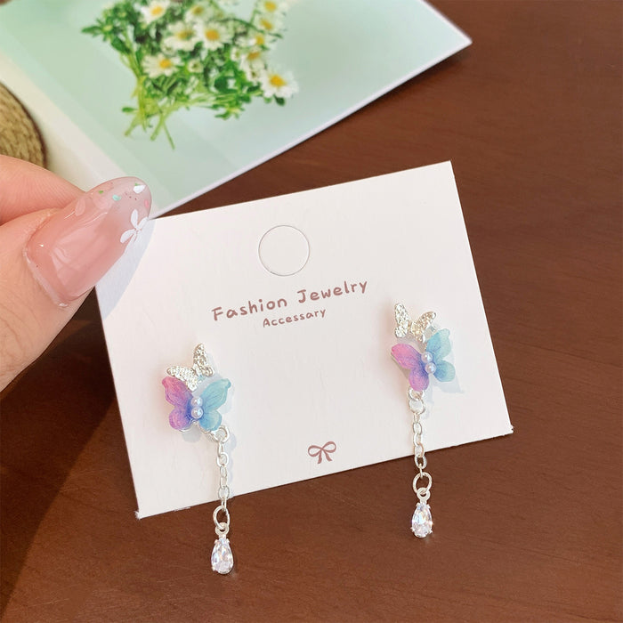 Wholesale Resin pearl butterfly earrings with tassels and silver needles, sweet temperament, light luxury, high-end feel, versatile earrings