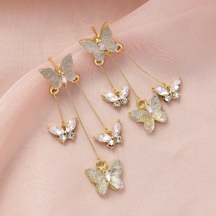 Wholesale Silver needle purple butterfly tassel earrings with a light luxury and high-end feel, sparkling diamond long earrings, retro temperament earrings