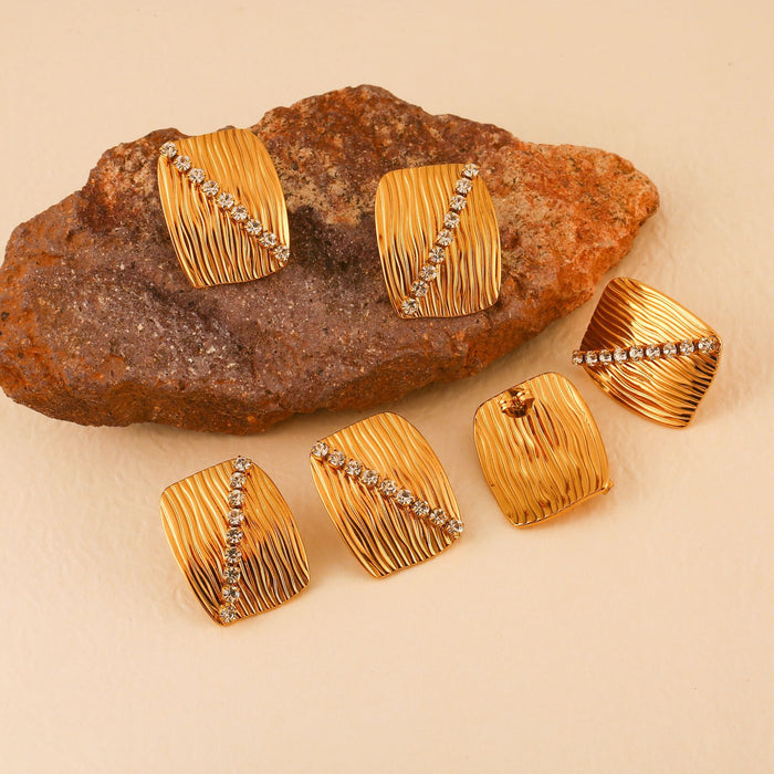 Wholesale Fashionable and personalized stainless steel zircon inlaid earrings and rings set, temperament earrings and bracelets