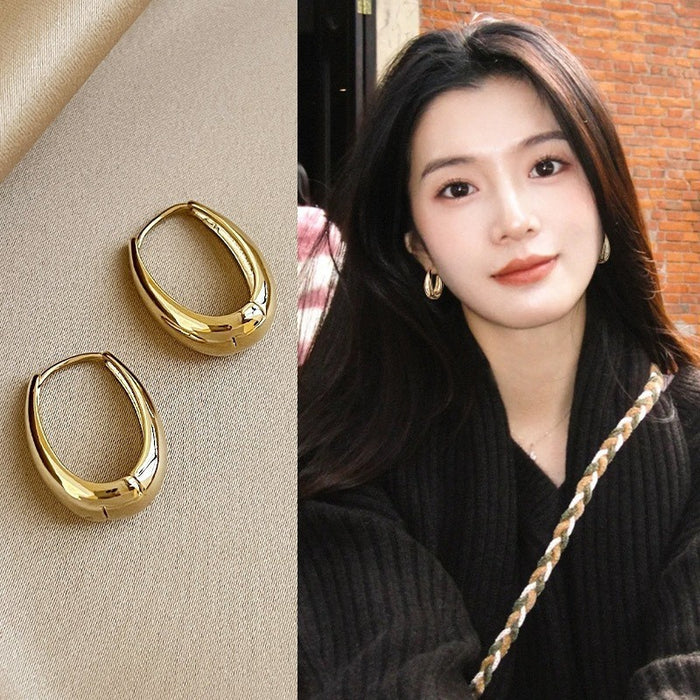 Wholesale Gold colored plain ring earrings, elegant earrings, studs, niche design, high-end ear rings, and earrings