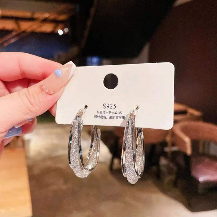 Wholesale Metal earrings with hollowed out mesh and crystal circles, earrings with a subtle touch of elegance, and female earrings with inlaid details