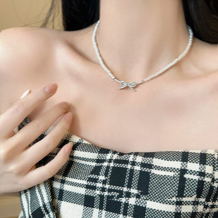 Wholesale Butterfly knot pearl necklace, simple and niche fashion, light luxury, versatile collarbone chain accessories