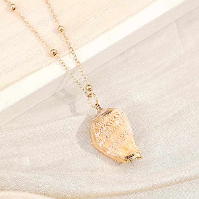 Wholesale Gold edged conch and seashell necklace
