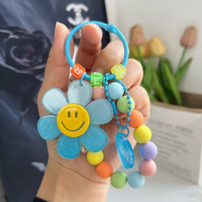Wholesale Cute letter sunflower bag pendant with smiling face, colorful handmade bead key chain