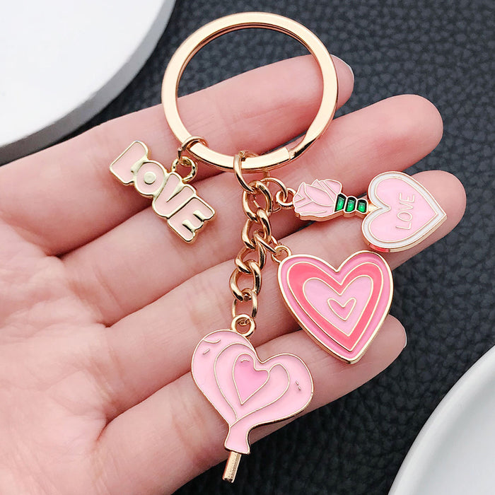 Wholesale Cute pink heart-shaped rose potion metal  keychain