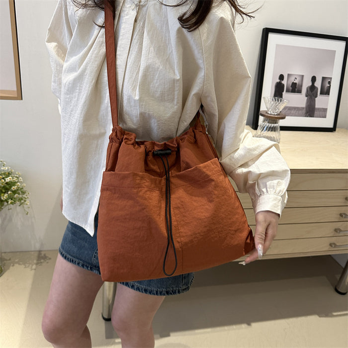 Wholesale Niche casual artistic canvas bucket bag, fashionable drawstring single shoulder pleated nylon crossbody bag