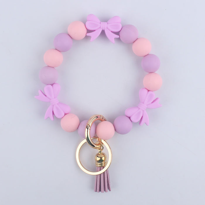 Wholesale Cartoon bow silicone bracelet keychain handmade beaded bracelet jewelry