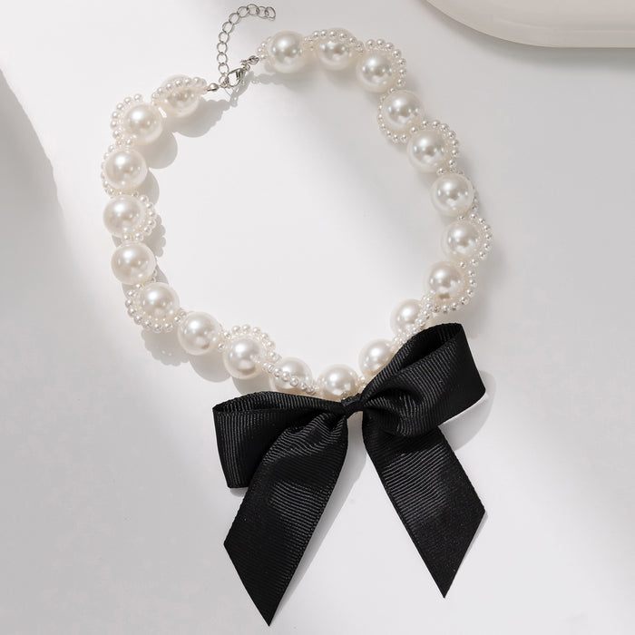 Wholesale Retro exaggerated ribbon bow necklace with light luxury and high-end feel, imitation pearl collarbone chain necklace