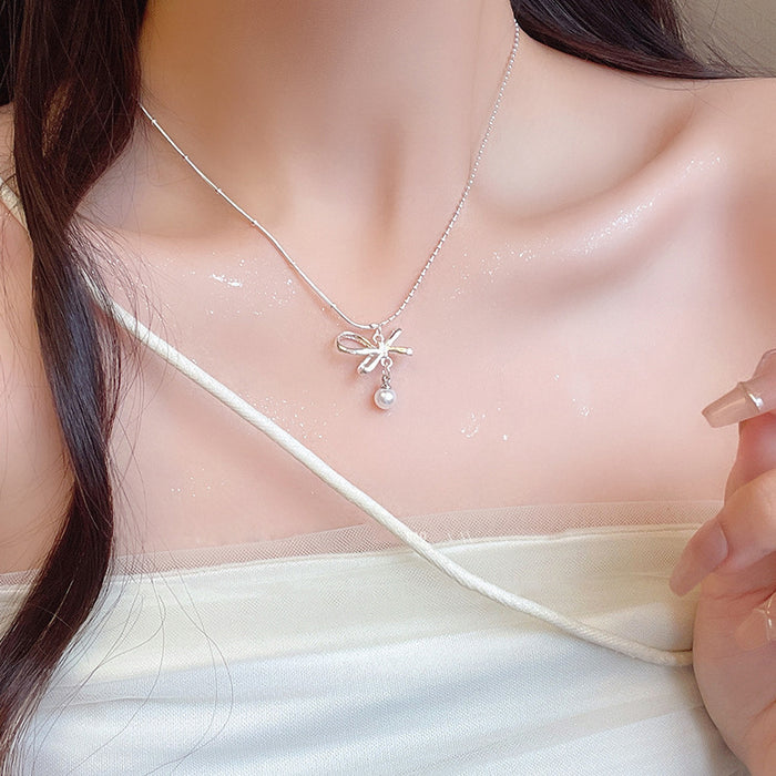 Wholesale New bow pearl pendant necklace with gentle and elegant temperament, light luxury and versatile collarbone chain