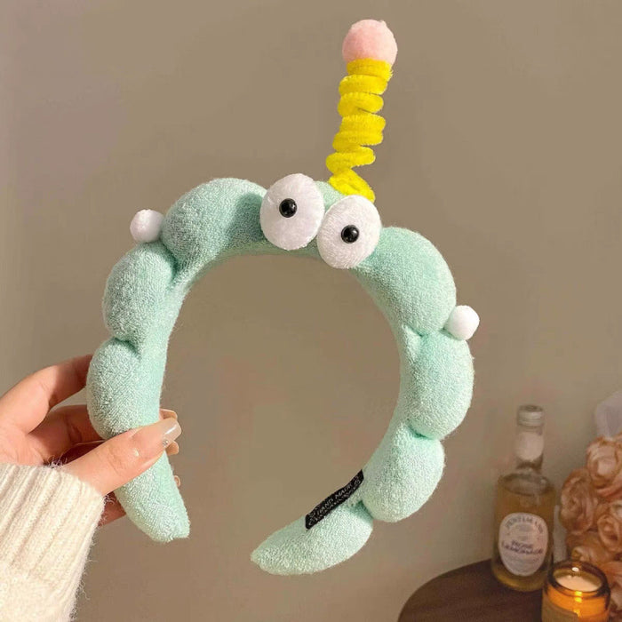 Wholesale Cute girl' s twistable hairband with big-eyed plush toy design.