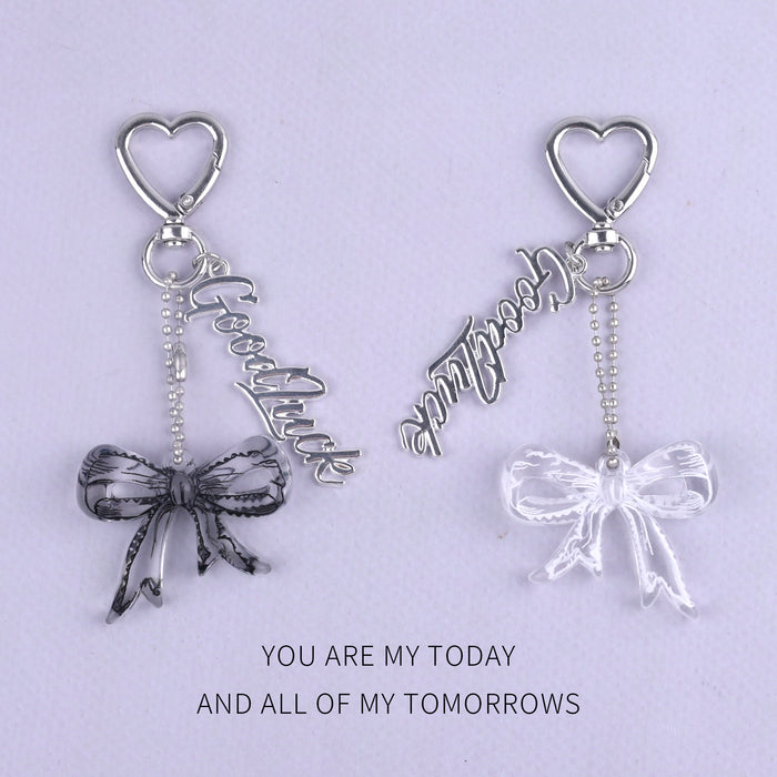 Wholesale Trendy black and white transparent bow acrylic heart keychain bag pendant personalized letter creative accessories