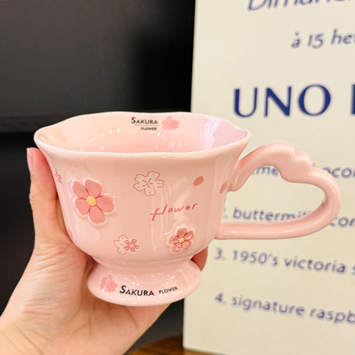 Wholesale Pink ceramic stemmed cup with cherry blossom relief design and spoon