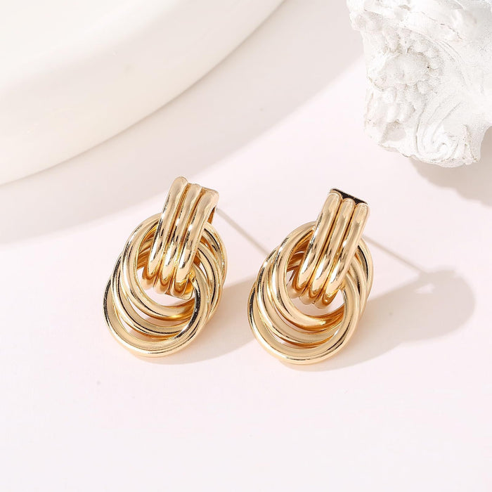 Wholesale Exaggerated double knot earrings, personalized copper plated earrings, niche high-end, light luxury temperament earrings